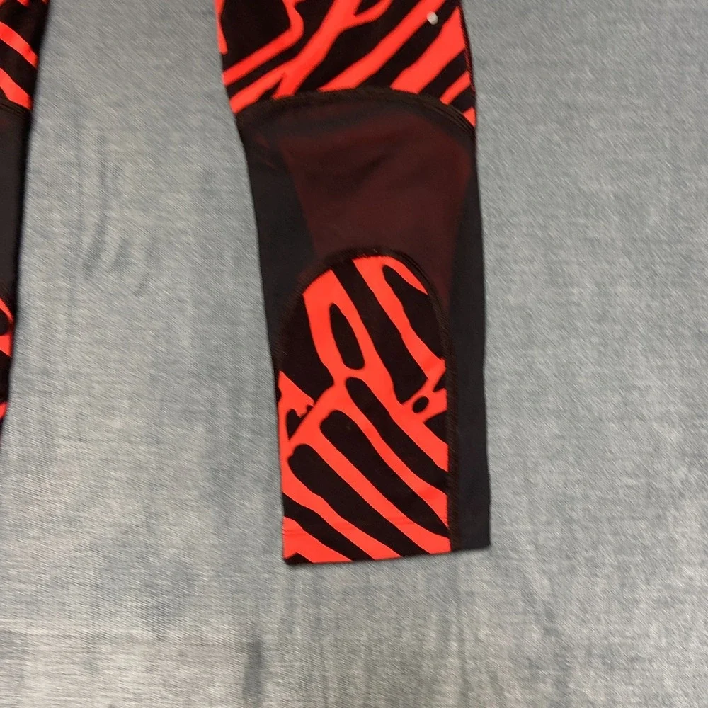 Nike Dri Fit Power Epic Lux Capri Leggings Womens XS Black Orange Abstract Print